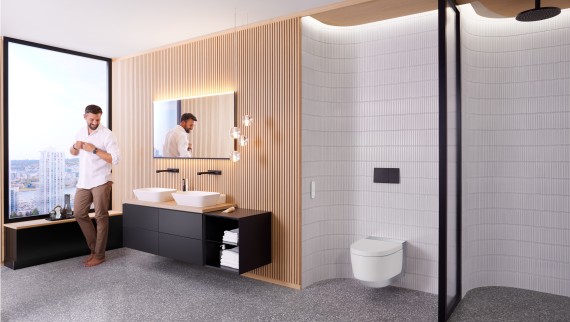 Чоловік у ванній кімнаті Geberit ONE з Geberit AquaClean Mera та дзеркалом Geberit Option Plus Чоловік у ванній кімнаті Geberit ONE з Geberit AquaClean Mera та дзеркалом Geberit Option Plus