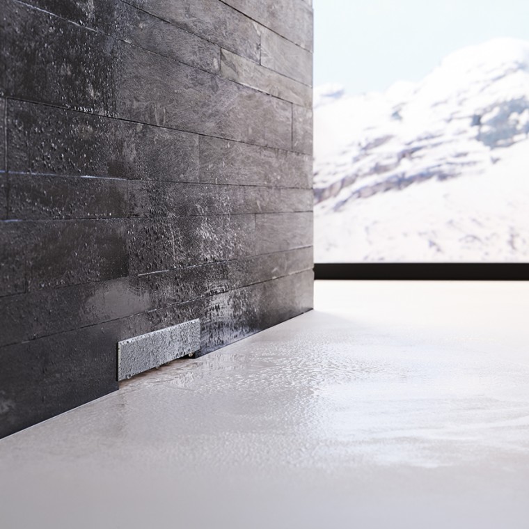 Трапа Geberit у чорній цегляній стіні Трапа Geberit у чорній цегляній стіні